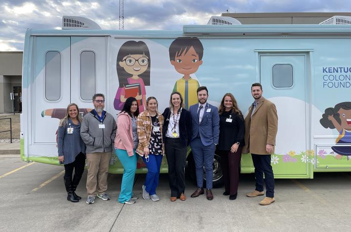 image of group of providers in front of mobile clinic