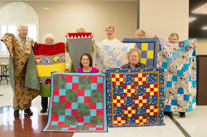 The Bluegrass chapter of Quilts for Kids present some of the quilts they have made