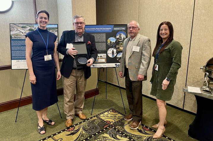 Graham Gray (second from left), executive director of Utilities and Energy Management, along with Cara Boggess, Bob Pickerill and Megan Hogan with Bell Engineering accepted the award. 