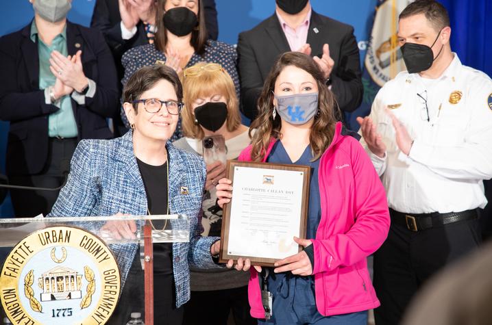 image of Charlotte receiving an award from Lexington mayor