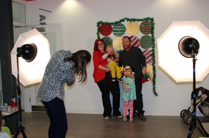 photo of family getting holiday photos - Open Studio 2015