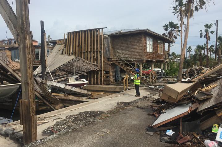 Photo of Mariantonieta Gutierrez Soto surveying damage