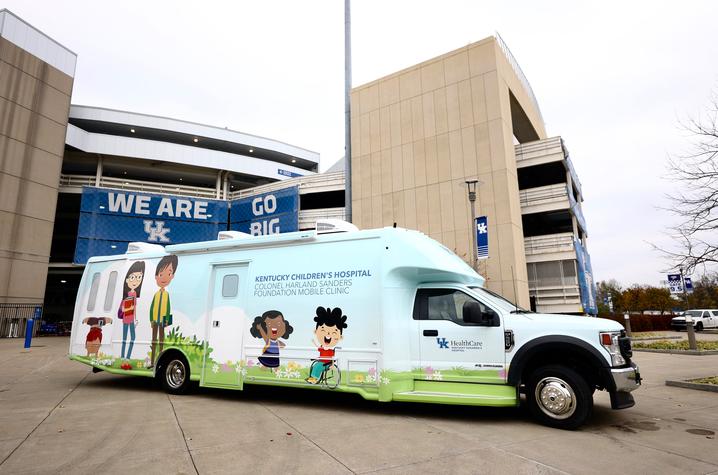 image of mobile clinic parked in front of Kroger Field stadium
