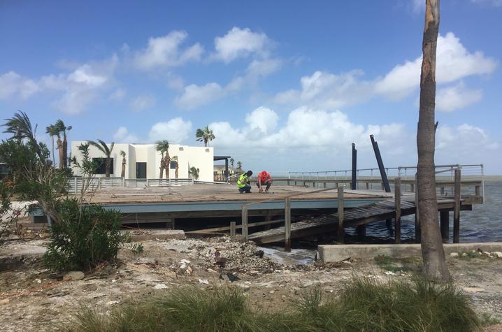 Photo of Mariantonieta Gutierrez Soto surveying damage