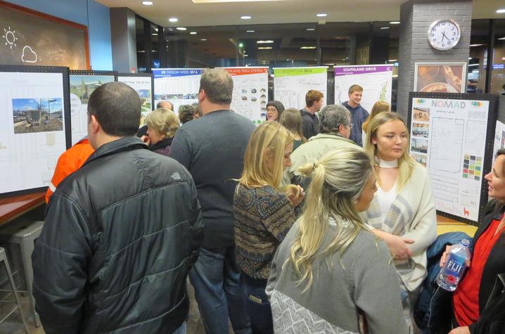 photo of people at Southland Design exhibit at Good Foods Co-op