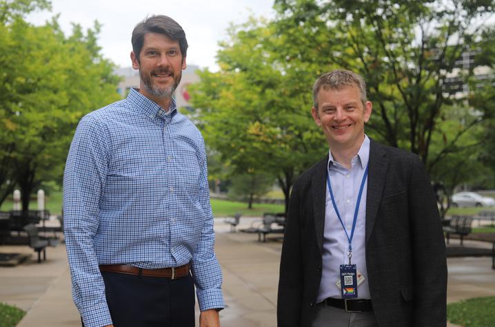 jonathan wenk and kenneth campbell standing outside smiling