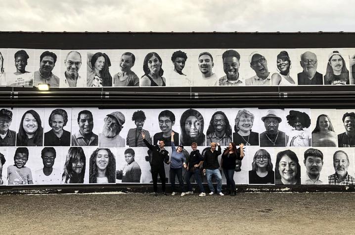 students from guerrilla art class with InsideOutLex installation on Carson's wall