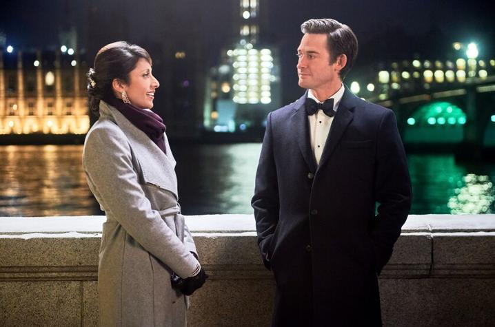 photo still of Reshma Shetty and Will Kemp with London background from "Jolly Good Christmas"