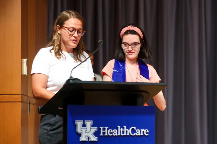 Karly (right) stands with Project SEARCH Program Instructor Holly McCombs (left) during graduation. Carter Skaggs | UKphoto
