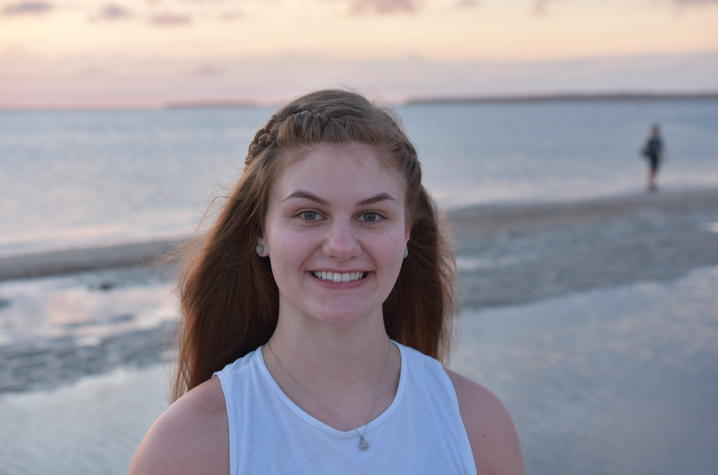 photo of Kayli Bolton on beach with ocean behind her