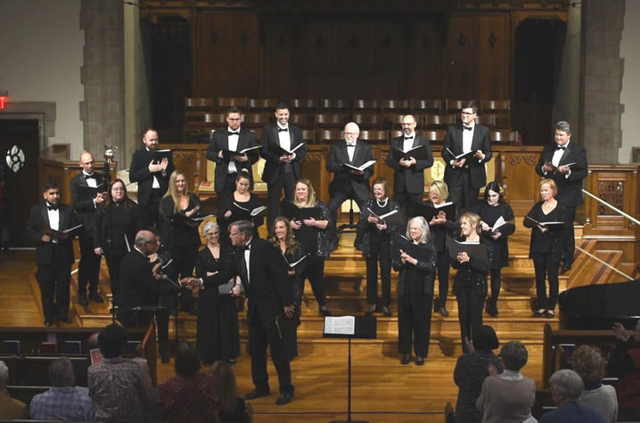 Jeffrey Jones shaking the hand of the conductor, Dr. Anderson, at the conclusion of the performance of his five-movement piece for chamber choir. 