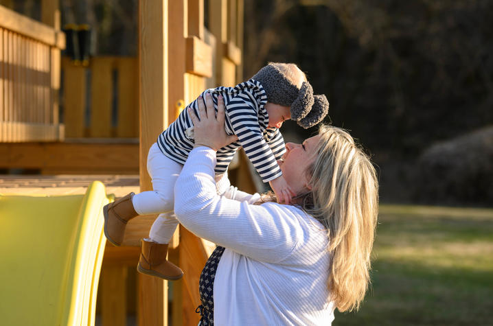 image of Felicia with baby MaKenzie on a playground