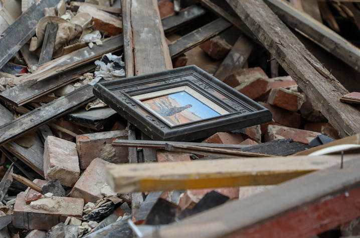 Painting lying on top of a pile of debris after a tornado in Western Kentucky