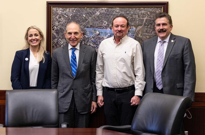 Image of Manuel Boggs with President Capilouto, Dr. Newman, and Jennifer Decker