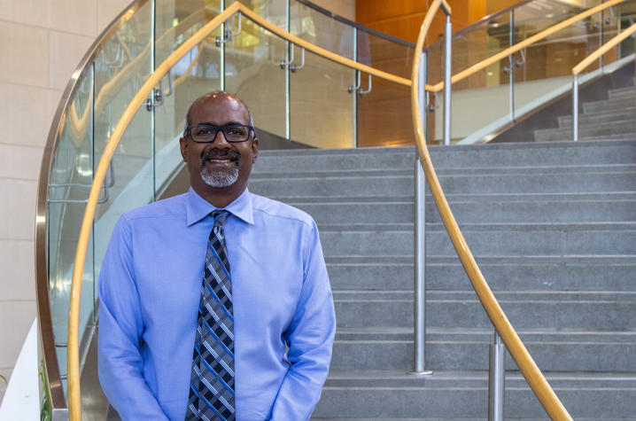 Image of Dr. Rajagopalan standing in front of stairs