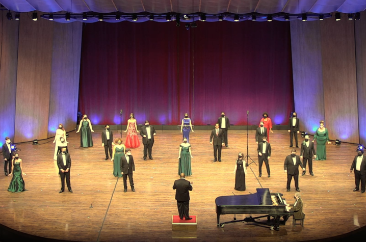 Photo of members of UK Opera Theatre performing six feet apart on the Singletary Center stage for the virtual performance.