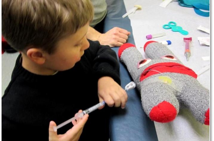 Child playing with Cellie toy