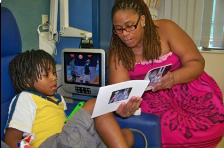 Mother and Child reading from the Cellie coping book