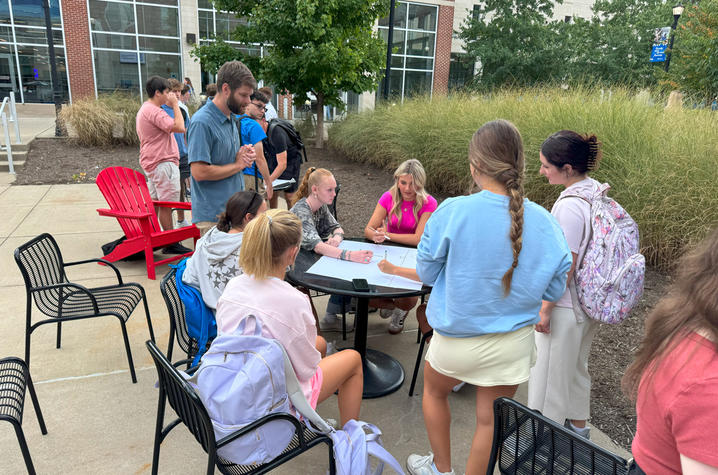 Honors students planning pollinator garden