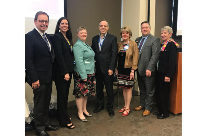 Photo of a group of researchers and healthcare professionals at RAPID research day