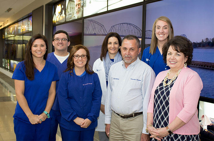 Darrell and Sherry Raikes alongside the Critical Care Unit team