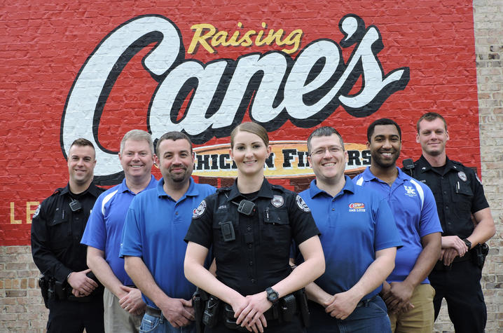 photo of UK Police officers and Raising Cane's personnel