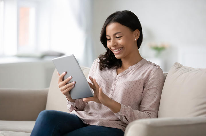 Woman working on her iPad. 