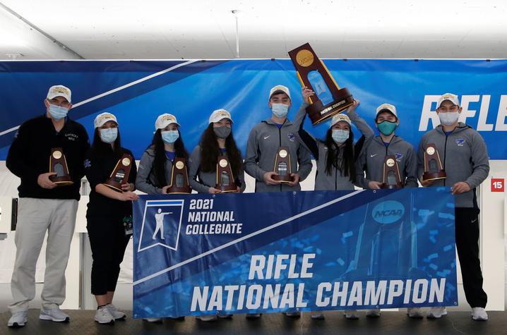 photo of UK Rifle team with awards at 2021 NCAA National Championship