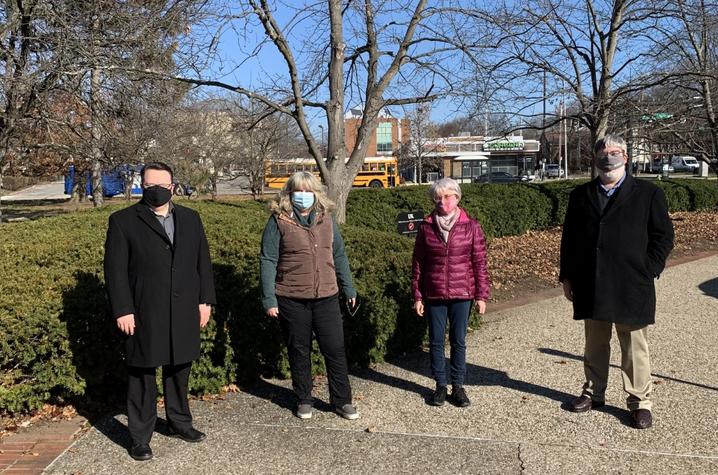 photo of masked Stanley Pelkey, Allison Rogers, Sandy Dunn, and Mark Shanda