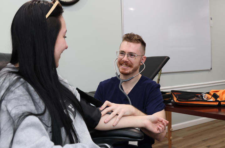 Nurse taking blood pressure reading during a CATS Clinic 