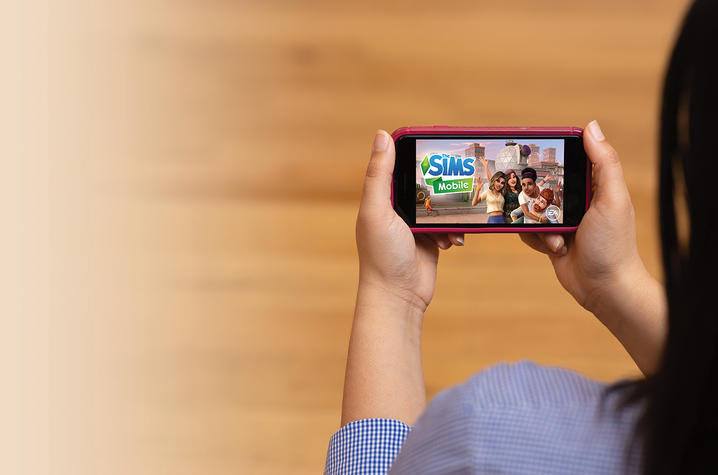 Picture of The Sims on mobile device.
