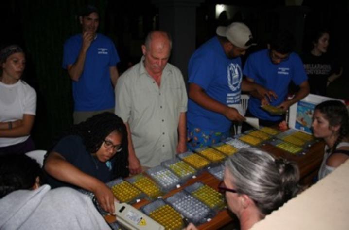 Analyzing water samples for coliform and E. coli bacteria (Dr. Nicholas Nickl and brigade students observing).