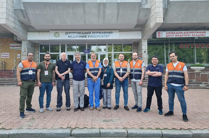 a group of surgical trainers standing together in front of a medical center in Ukraine