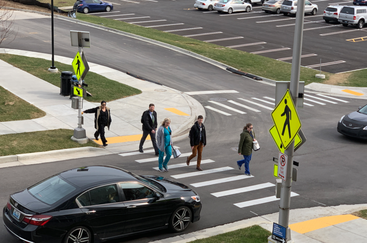 Pedestrians crossing a cross walk.