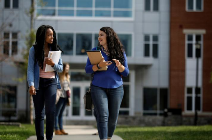 Two girls walking to class. 