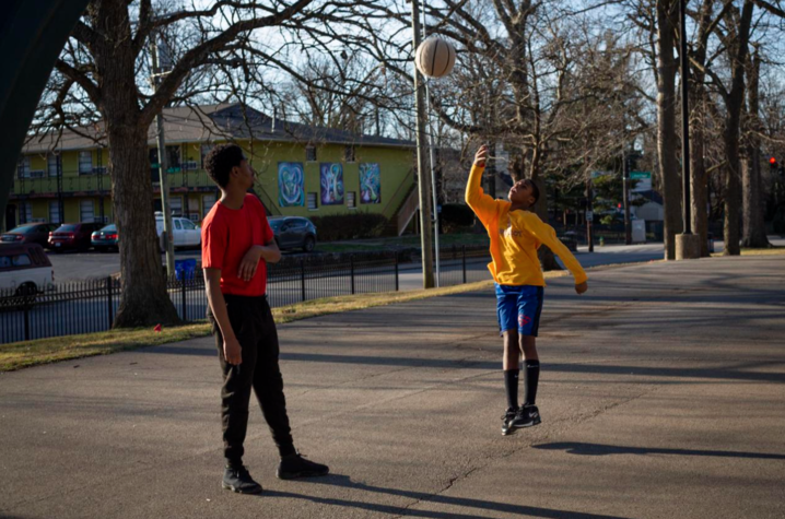 Bryan Greene, 25, and Lakell Gates, 11, play basketball on the court in Duncan Park in Lexington, Kentucky, on Sunday, Feb. 2, 2020.