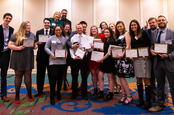 The Kentucky Kernel staff celebrate winning the KPA General Excellence Award for Large Collegiate Papers in January 2020, the last time they were able to celebrate awards together before the pandemic began.