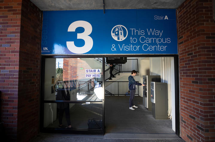 photo inside parking garage - student paying to park