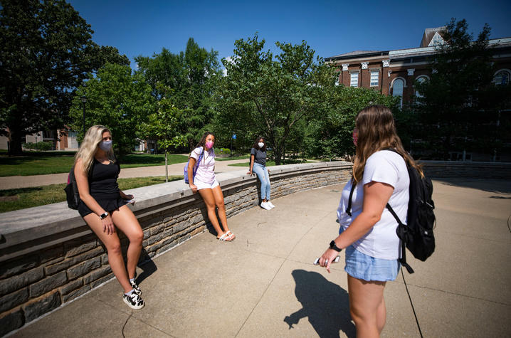 students standing on campus