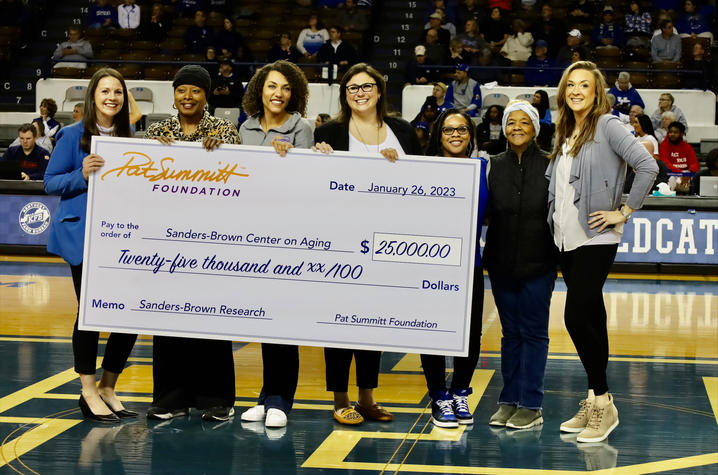 The Pat Summitt Foundation presented a $25,000 check to UK's Sanders-Brown Center on Aging during the women's basketball game on Jan. 26, 2023. Photo by James Haggie