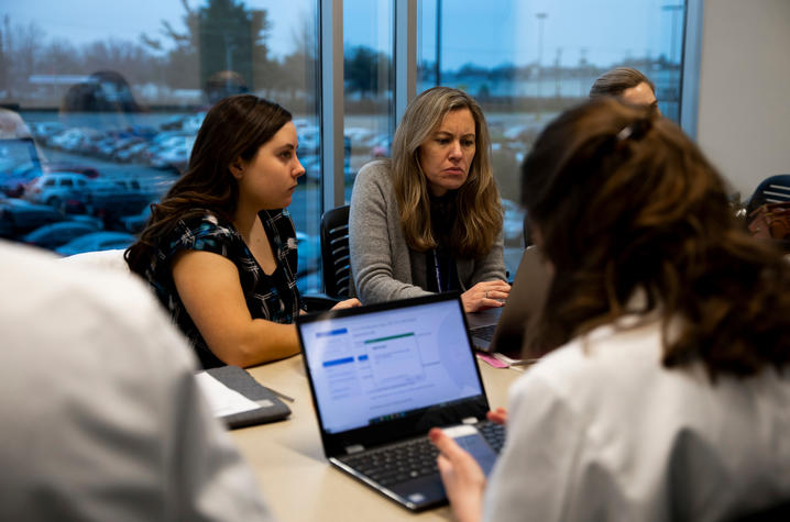 Students participate in a 'lunch and learn' activity as part of their TEAM Clinic experience