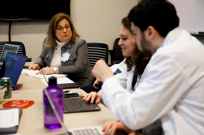 Dr. Carol Hustedde leads TEAM Clinic participants in a discussion on collaborative care