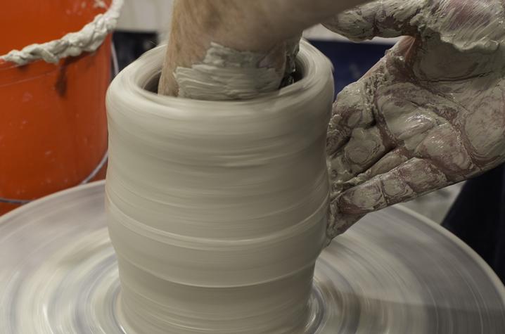 photo of hands working on ceramic vase - Fine Arts Institute