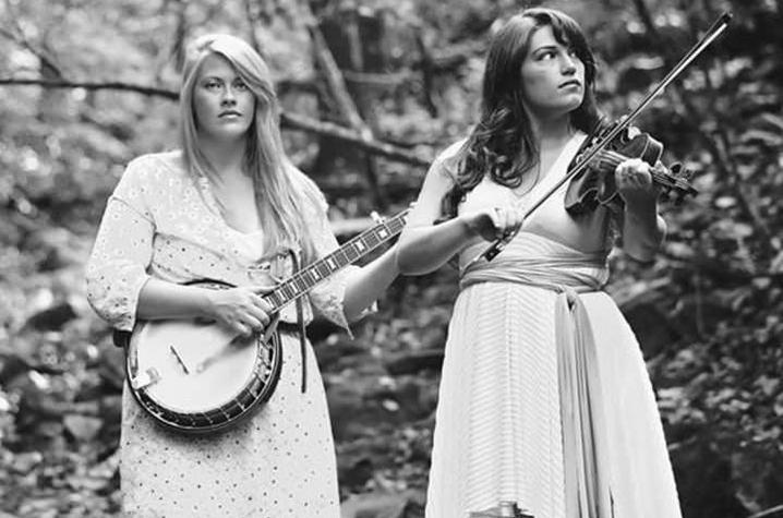black and white photo of The Local Honeys with instruments