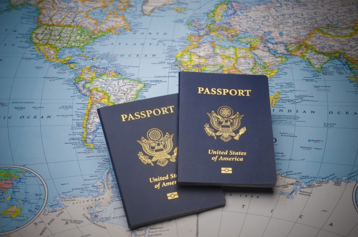 photo of 2 passports on world map