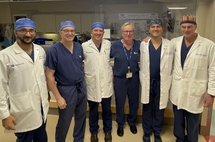 Tibbs (fourth from the left) plans to still see patients in clinic at the Kentucky Neuroscience Institute but if surgery is needed will be referring them to UK's team of neurosurgeons. Photo by David Dornbos