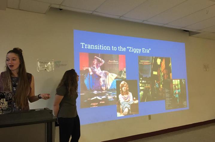 students presenting on David Bowie photo of students presenting on David Bowie