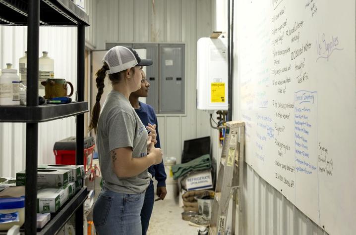 Students review the daily checklist board at Chaney's Dairy Barn Students review the daily checklist board at Chaney's Dairy Barn