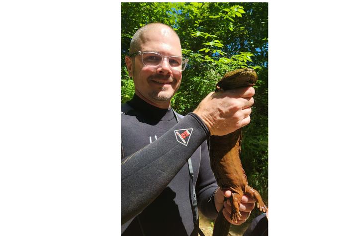 Steven Price holding hellbender  Steven Price holding hellbender