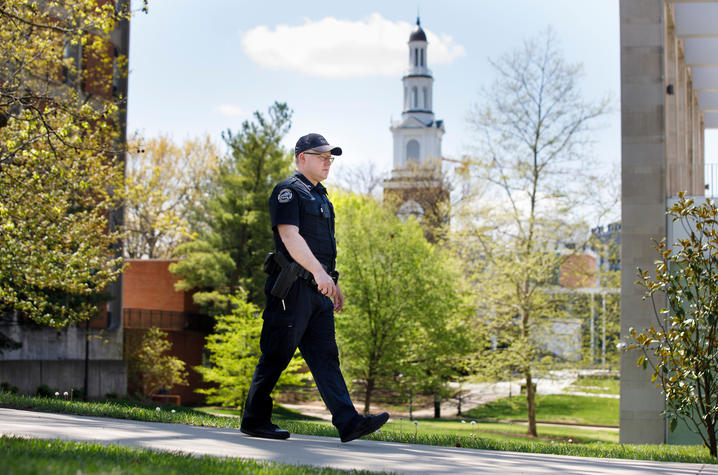 UK Police officer walking across campus